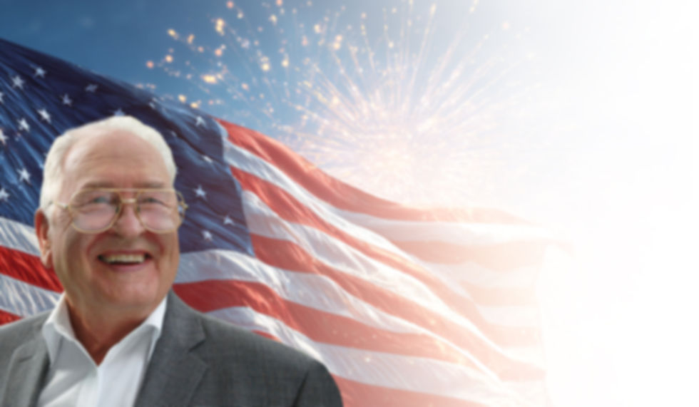 John S. Owsinek with American flag background, facing right