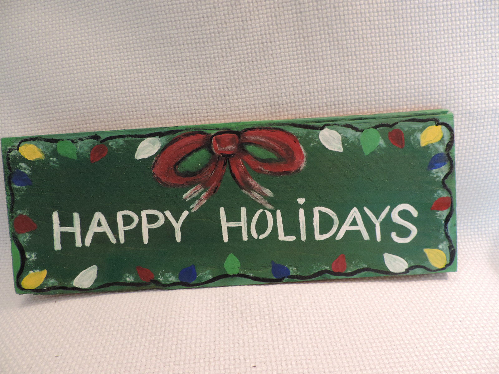 "Happy Holidays" hand painted sign