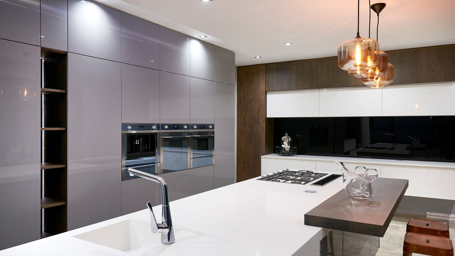 A stunning Linear Concepts kitchen from the Lucid range. Highlights include a two-toned island and bespoke lighting fixtures.