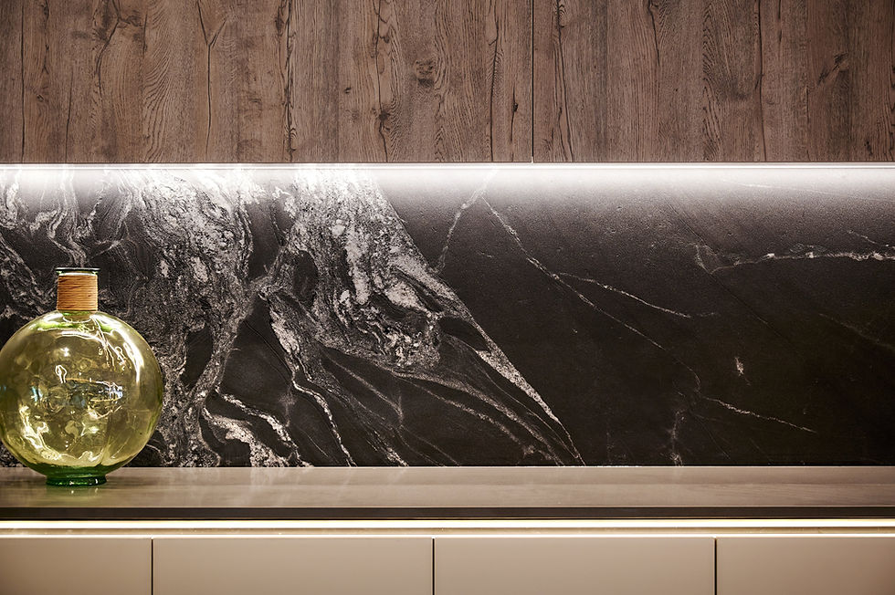 A close-up on the Senza kitchen's wall units, revealing an intricate, textured backsplash with vivid hues and patterns that evoke natural beauty, set against minimalist, European-designer shelving.