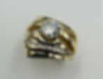 Remounting for customer's diamond with added accent diamonds in 14k yellow gold