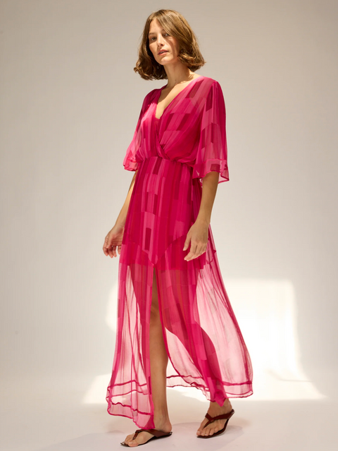 A woman in a pink dress