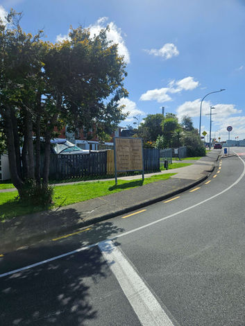 wide shot of wooden sign at the entrance of torbay