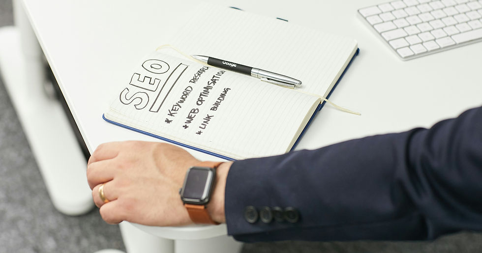 Notebook with “SEO” written in large letters alongside a Google-branded pen, listing traditional tactics like keyword research, web optimisation, and link building - symbolising outdated SEO methods.