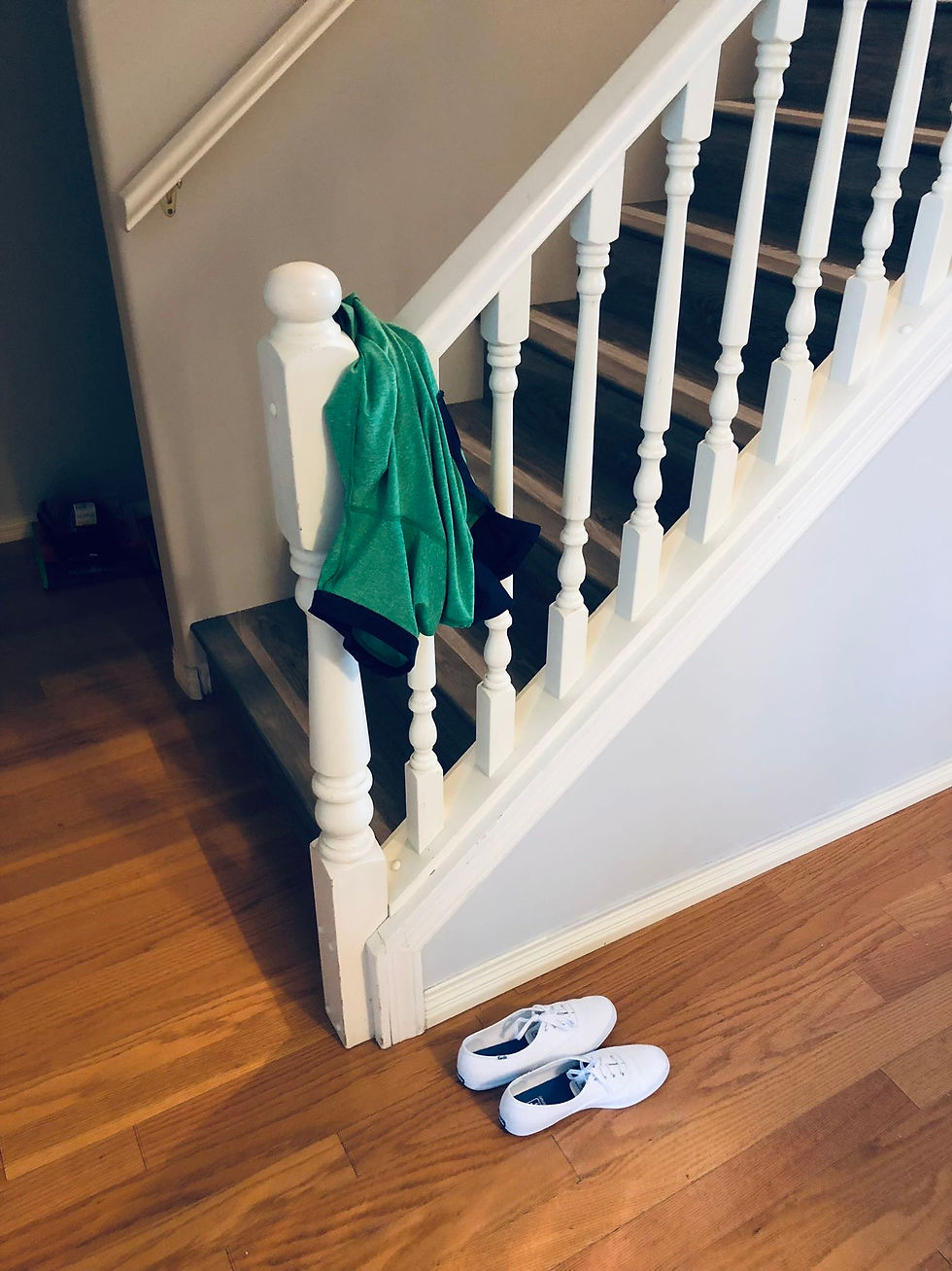 stairs with gray flooring and white spindles