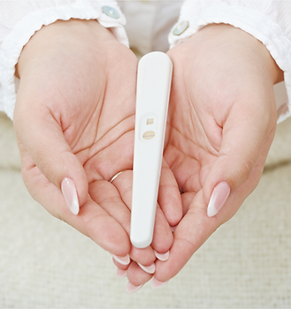 Pregnancy Test in Hands.png