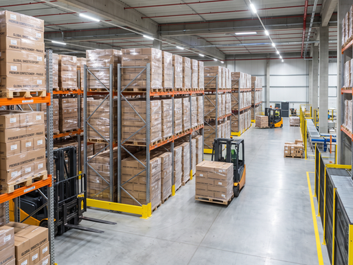 Neat pallets of export chocolate master cartons inside a modern logistics warehouse