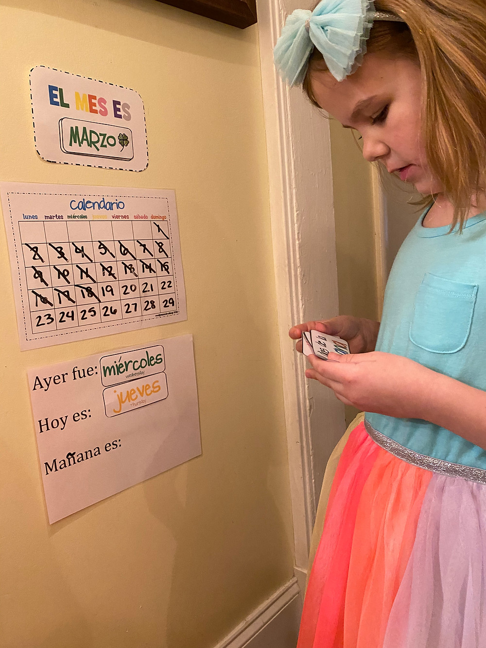 Practicing her Spanish vocab with our calendar