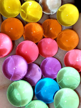 Close-up of colourful marbles, a vibrant array of different colours and textures.