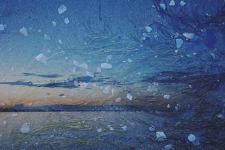 Sky over water and land with scattered shapes and textures.