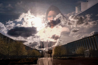 A woman's translucent image is overlaid on a sky filled with dramatic clouds, over a tree-lined building corridor. The scene conveys a poetic, ethereal tone.