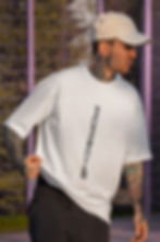 Man in white Porsche tee