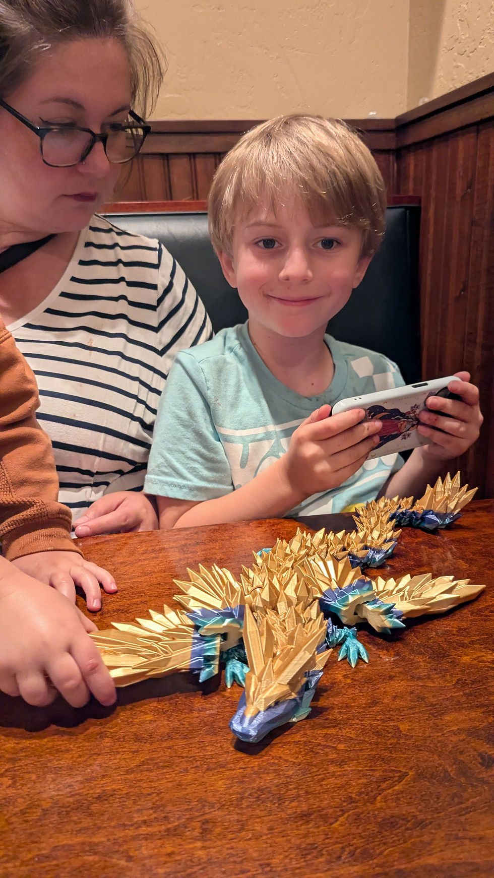 Eating lunch at the Village Pub and playing with their purchases....big dragon 