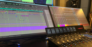 A Pro Tools desktop with mix controller.