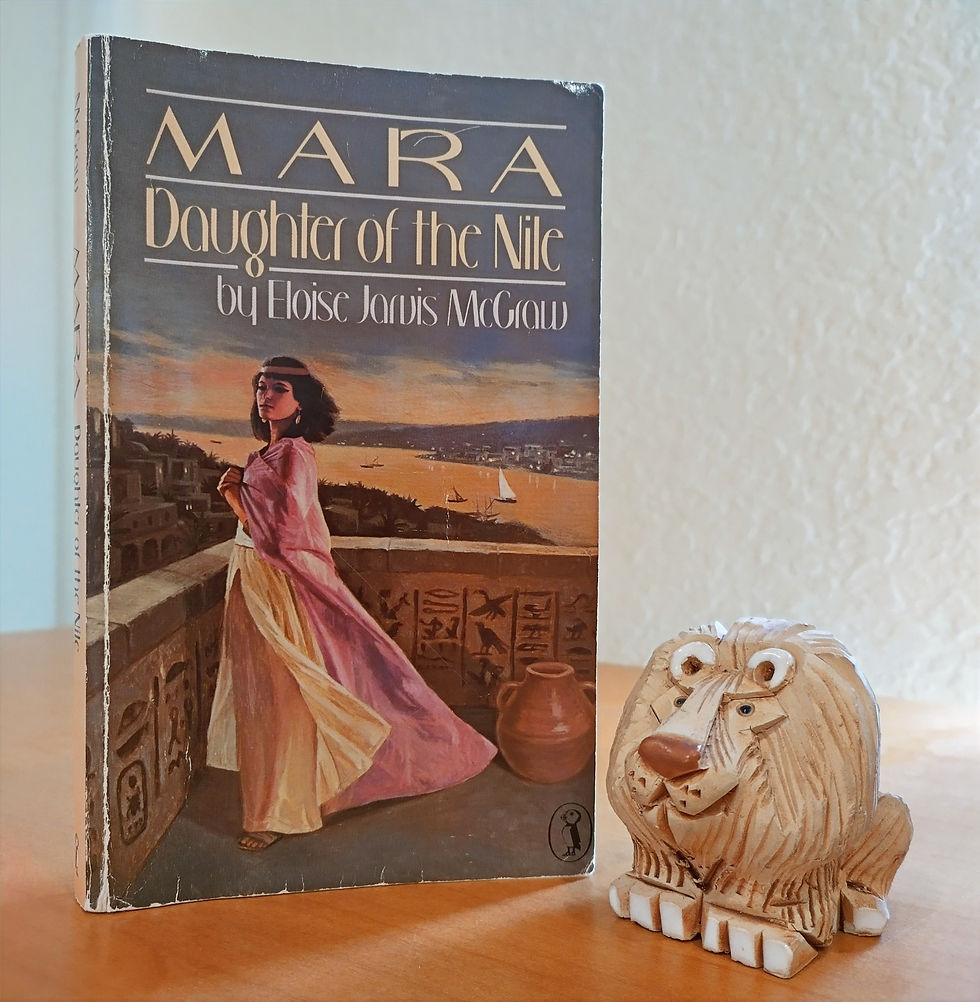 A girl standing on a stone balcony overlooking ancient Egypt.