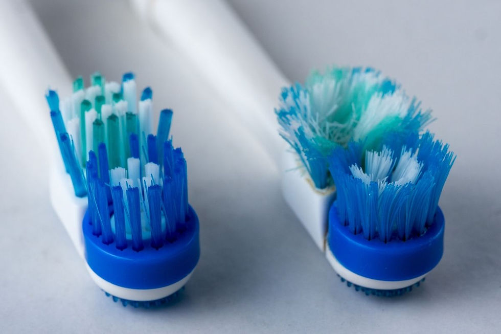 Worn out toothbrush with splayed bristles that needs replacing