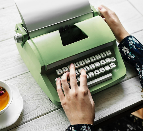 typing on a green typewriter
