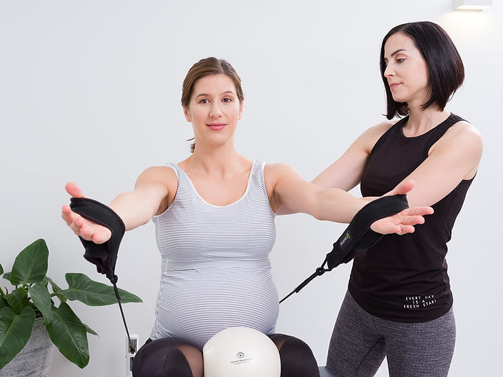 pilates-prenatal-hands in straps.jpg