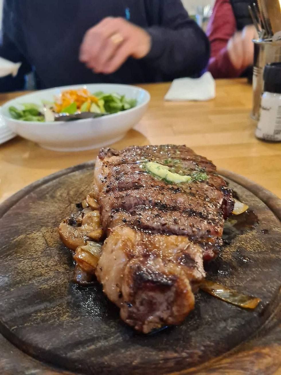 Grilled steak with butter at The Chalets Restaurant