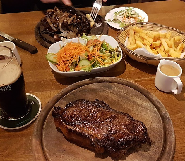 Steak and chips at The Chalets Restaurant with Murphy's stout