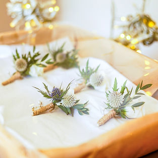 a set of wedding boutonnieres before the ceremony