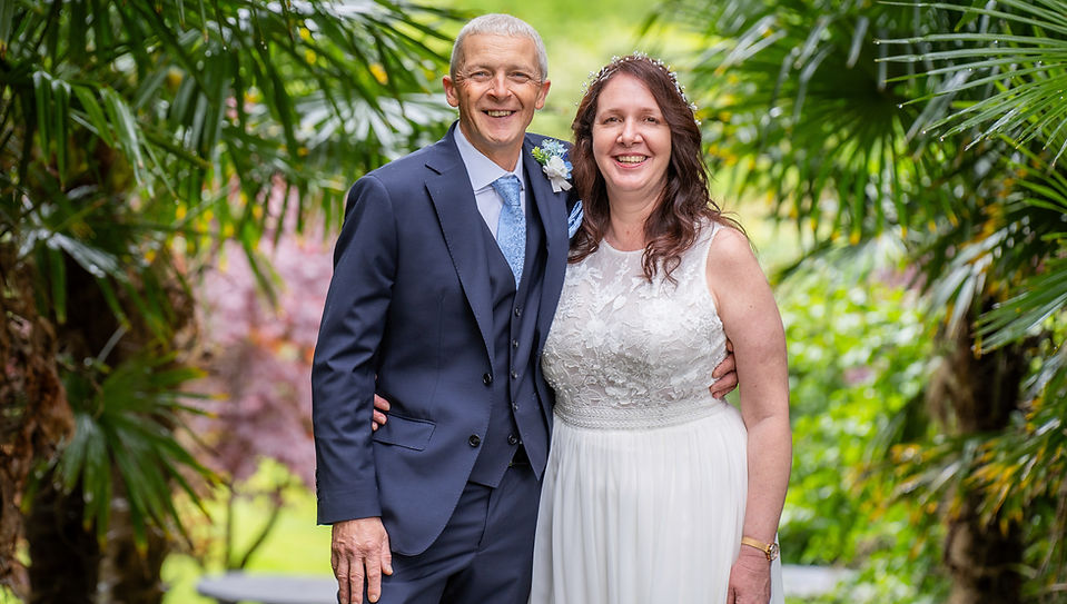 Dreamy couple wedding portrait near palm trees