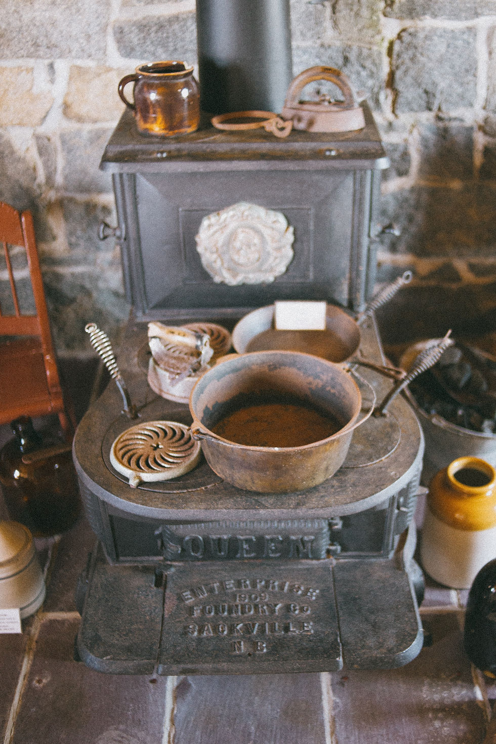 Rusty cast iron pans on an old fashioned stove