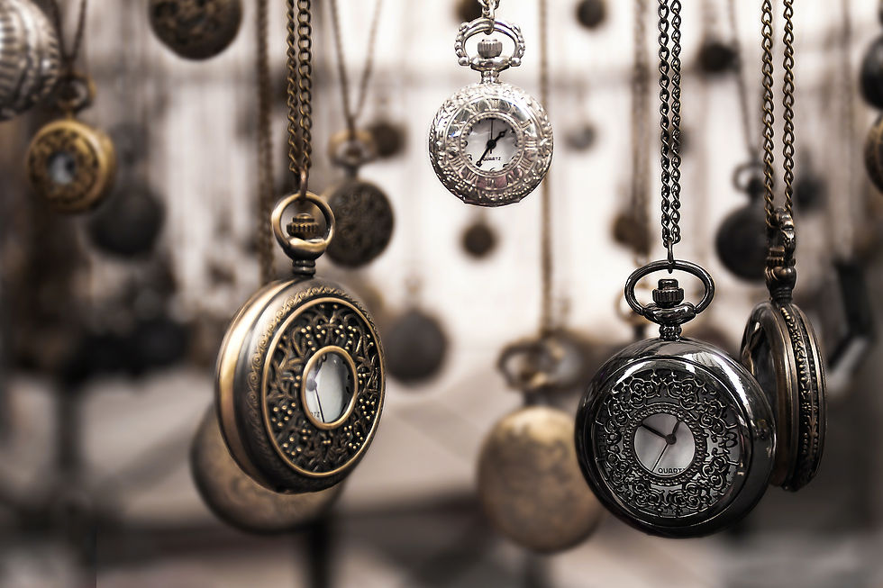 Different styles and sizes watches hanging from watch chains