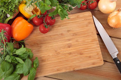 herbs-and-vegetables-with-a-chopping-board_1147-371