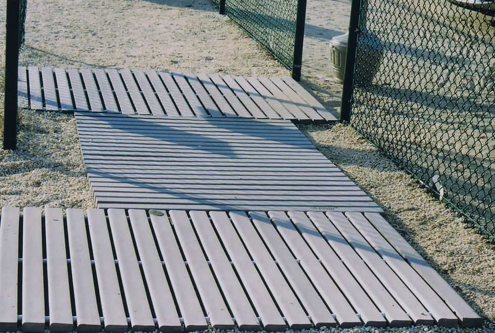 Thumbnail: Trex Roll Out Boardwalk sections on sandy path by fence