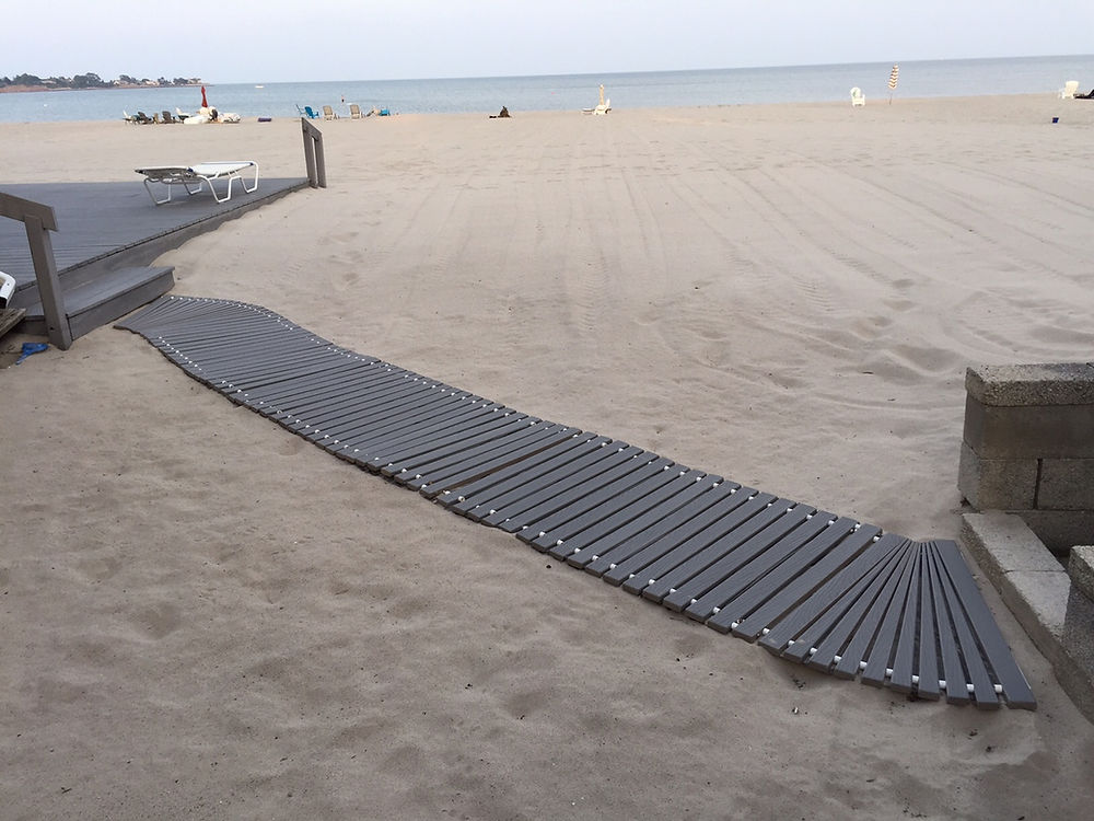 Mister Boardwalk mat on sandy beach to water