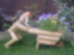 Wheelbarrow logman garden ornament
