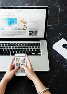 closeup-hands-using-mobile-phone-computer-laptop-black-marble-table (1).jpg