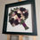 Thumbnail: Preserved wedding bouquet displayed in hand-tied silhouette inside a black wooden deep box frame