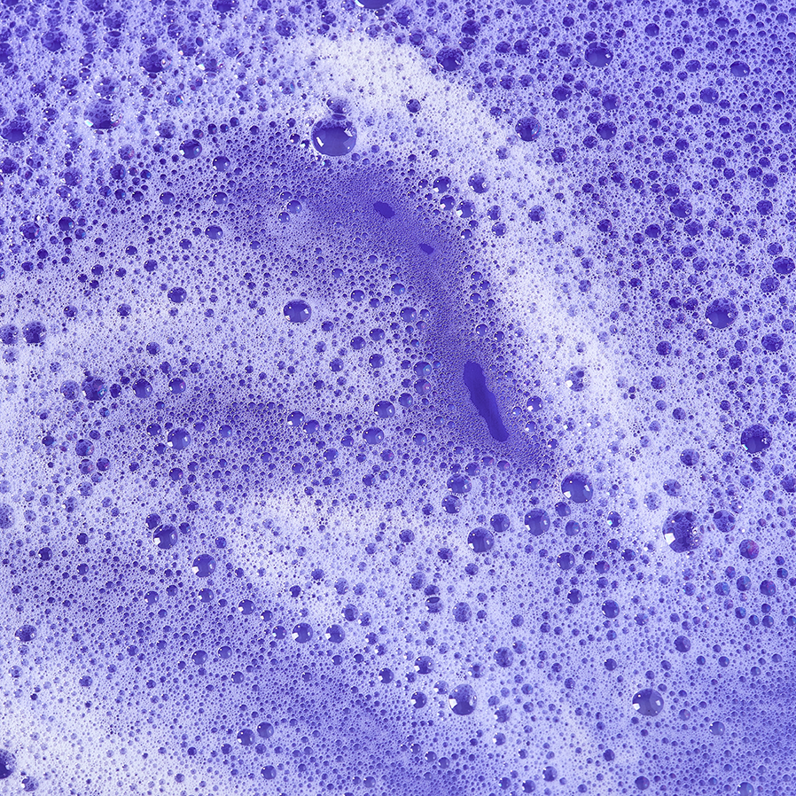 soap-and-shampoo-foam-on-purple-and-blue-backgroun-2022-11-11-07-34-06-utc copy.webp
