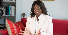 Rosalind Kainyah sat on couch