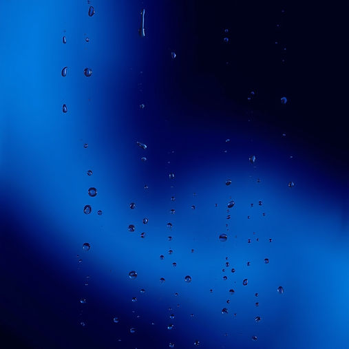dark blue background, the blue that's used on my site, with water droplets running down t
