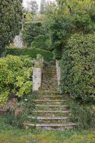 stairs in greenery garden views Lake Como fine art film and digital wedding photographer