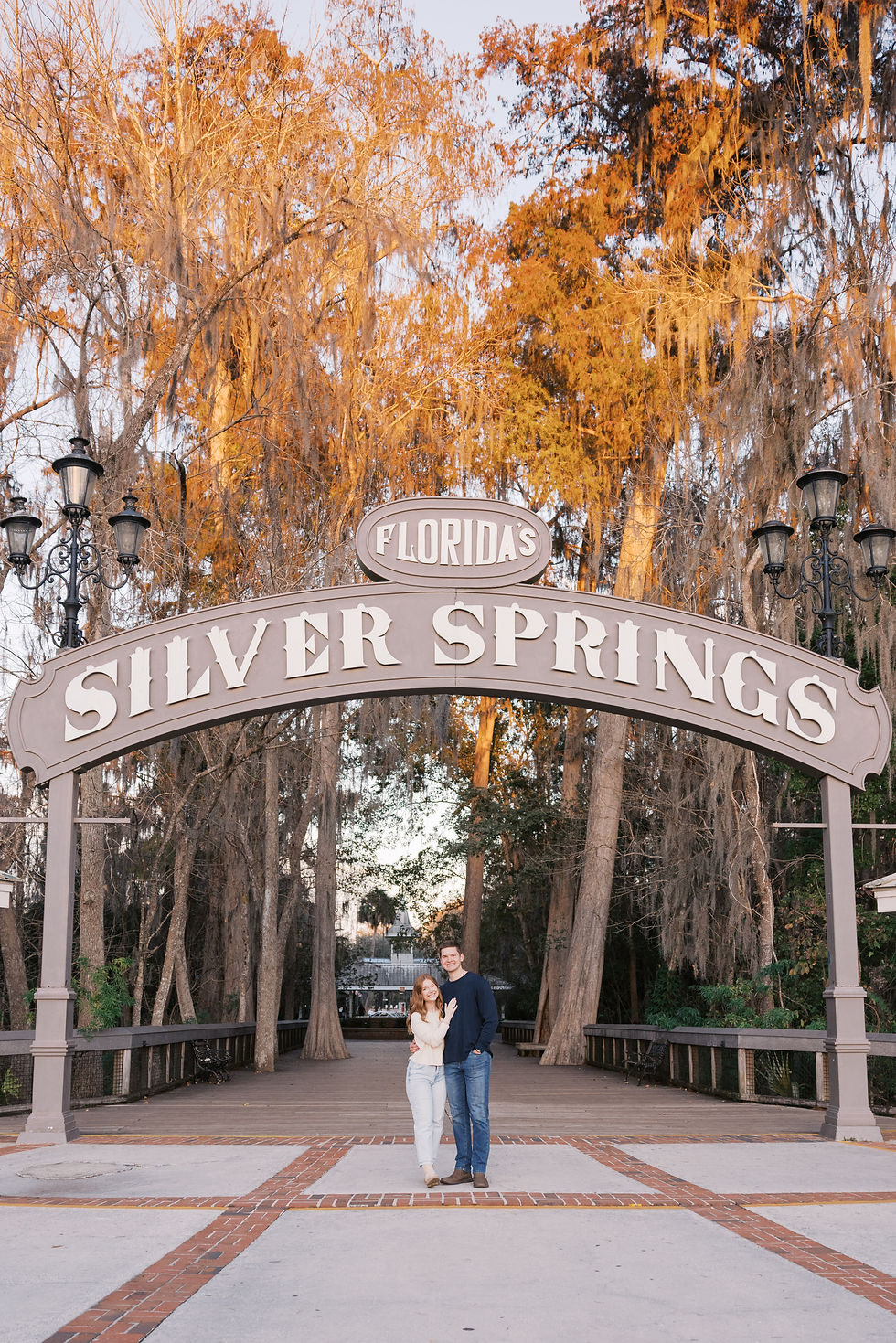 Luxury Florida engagement photography at Silver Springs State Park surrounded by cypress trees.