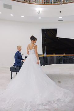 Newlyweds framed by marble columns at Whitehurst Gallery wedding inspiration