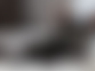 black cat staring directly at camera with bright green eyes