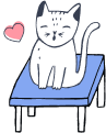 cat on a vet's table looking happy