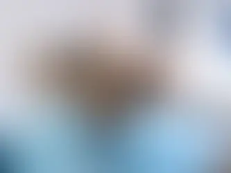 cat laying in a persons lap asleep