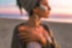 beautiful young fashion model on the beach at sunset portrait.jpg