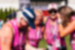 Friends running a 5k for breast cancer awareness.