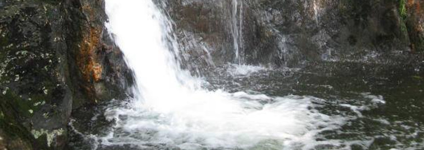Merlin's Pool at the base of Dinas Emrys - Wales.jpg