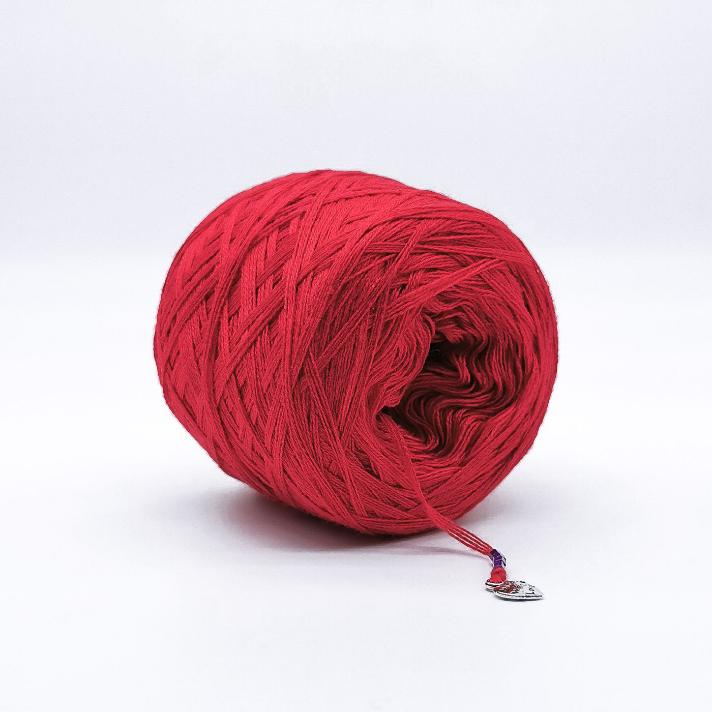 Red coloured yarn cake