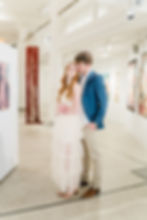 couple looking at each other in art museum