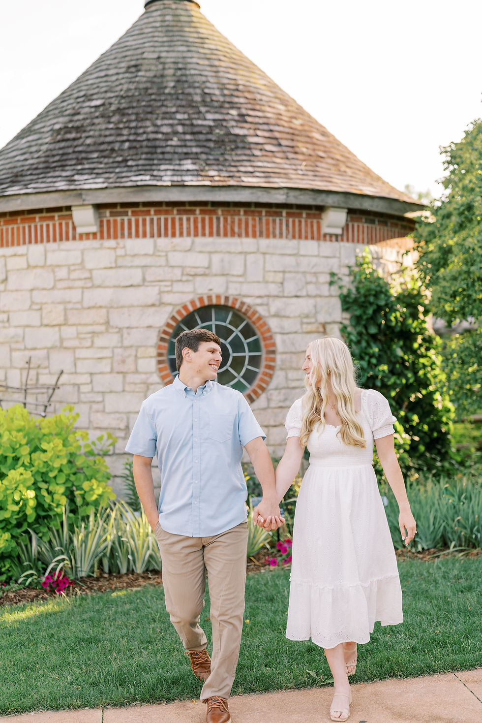 A couple walking in a garden landscape