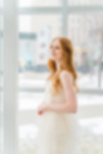 girl in morning lavender dress looking out smiling